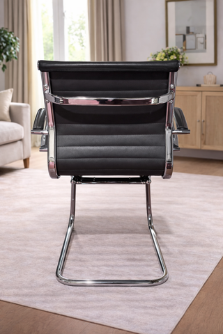 Silla confidente piel negra y cromado