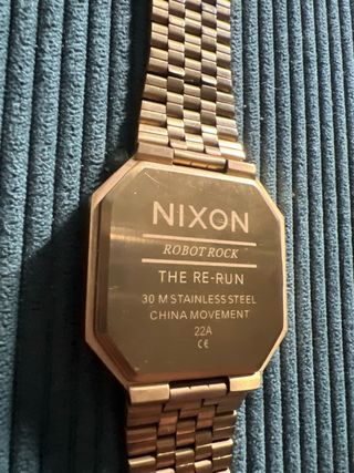 Reloj Nixon Re-Run Dorado y Negro
