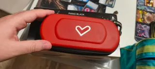 PSP 2004 negra con caja y juegos