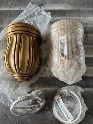 2 Bucaros Bronce y 2 Anillas Inox.