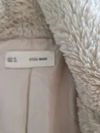 Abrigo de peluche color marfil