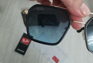 Occhiali da sole Ray-Ban neri e oro