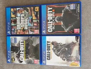 PlayStation 4 Negra + Mando + 4 juegos
