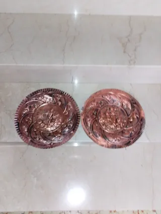 Coppia piatti decorativi rame sbalzato