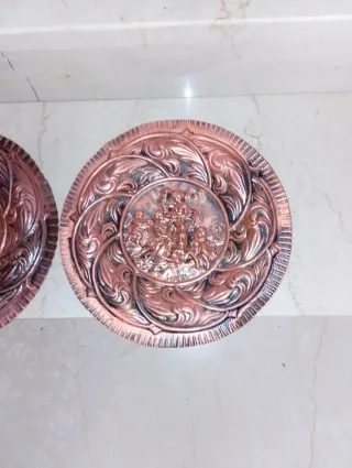 Coppia piatti decorativi rame sbalzato