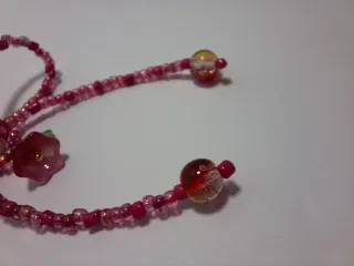 Portachiavi fiocco rosso con ciondolo rosa