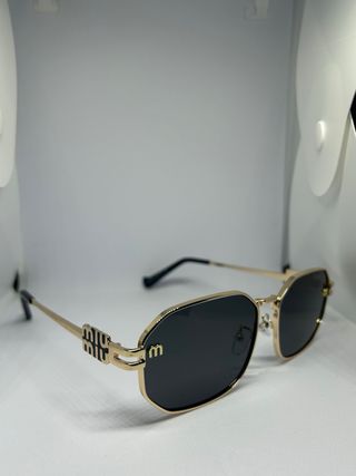 Occhiali da sole Miu Miu oro e neri