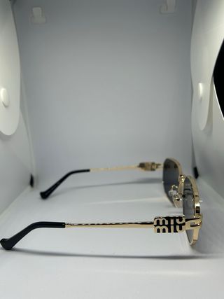 Occhiali da sole Miu Miu oro e neri