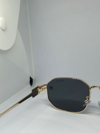 Occhiali da sole Miu Miu oro e neri