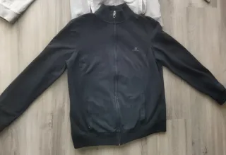 2 Chaquetas Deportivas Domyos (Negra y Gris).