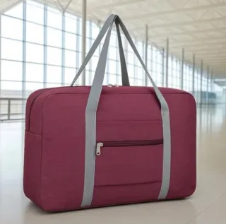 Bolso de viaje de mano rojo vino