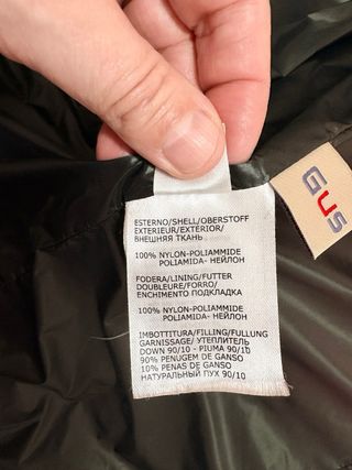 Plumífero verde con capucha y pelo