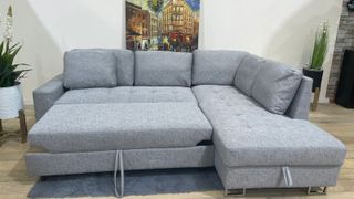 Elegante sofa rinconera con arcon y cama