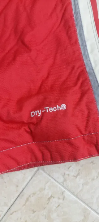 Pantaloni da sci rossi con bretelle