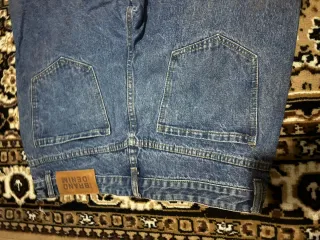 Jeans baggy strappati
