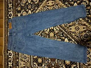 Jeans baggy strappati