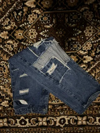 Jeans baggy strappati