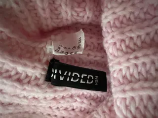 Jersey rosa cuello alto tejido