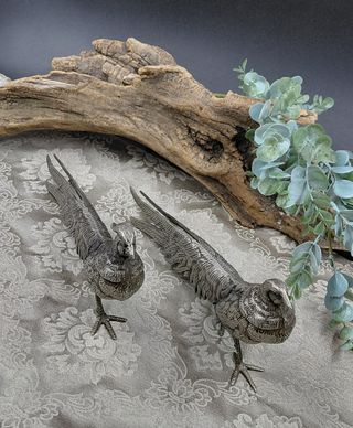 Coppia statue metallo argentato anni '70