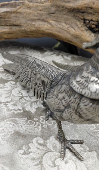 Coppia statue metallo argentato anni '70