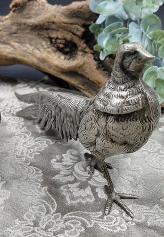 Coppia statue metallo argentato anni '70