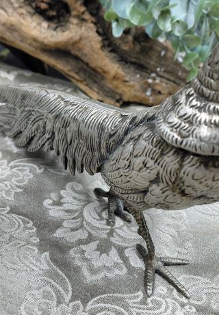 Coppia statue metallo argentato anni '70