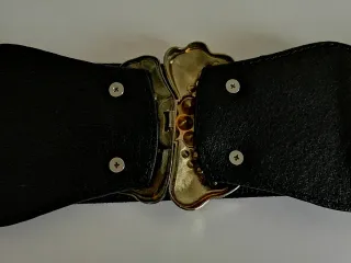 Cinturón elástico negro con flor joya