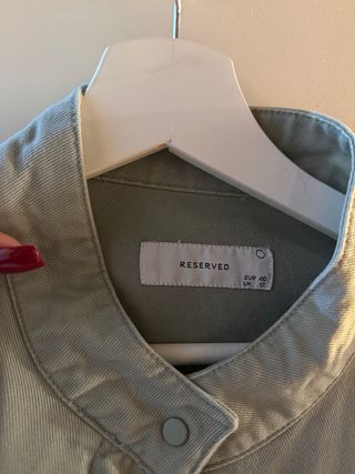 Chaqueta verde claro con flecos