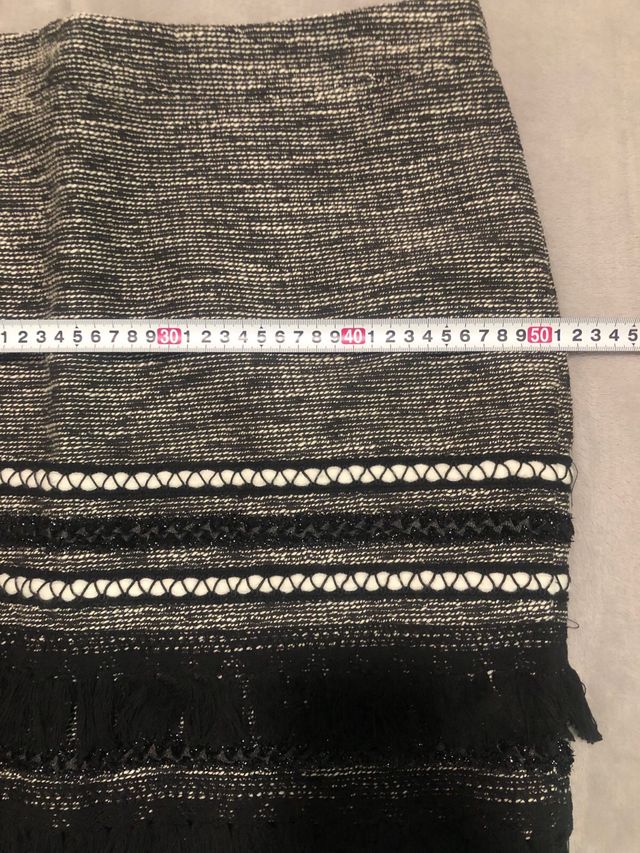 Falda mini tweed con flecos