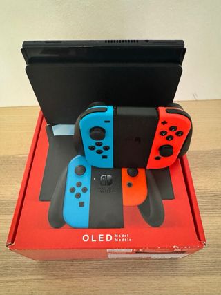 Nintendo Switch OLED azul/roja con todo