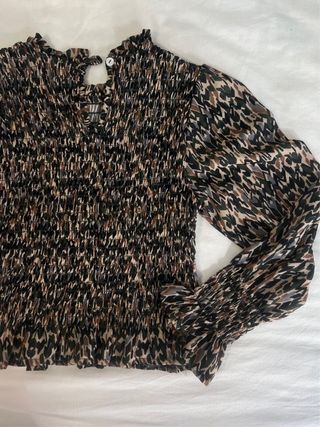 Blusa estampada geométrica manga larga