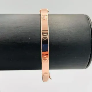 PULSERA RIGIDA TORNILLO ORO ROSA. Hueca. Oro 18k.