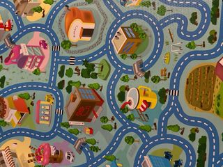 Alfombra de juego infantil con carreteras