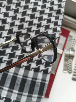 Cartier Gafas de vista negras y doradas