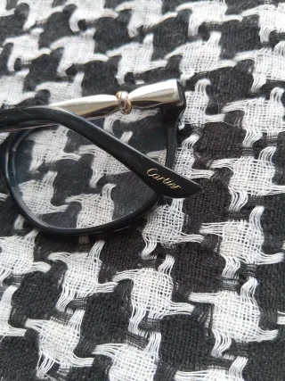 Cartier Gafas de vista negras y doradas