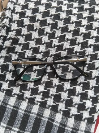 Cartier Gafas de vista negras y doradas