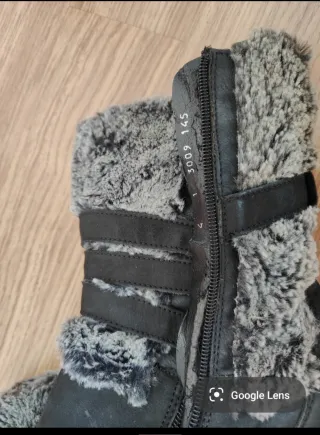 Botines negros Ara con pelo y hebillas