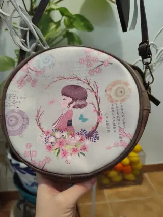 Bolso redondo estampado niña