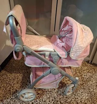 Carrito de juguete rosa para niña.