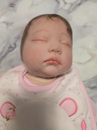 Bambola reborn con vestitino rosa