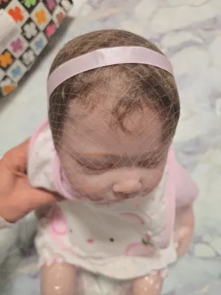 Bambola reborn con vestitino rosa