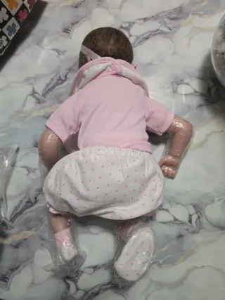 Bambola reborn con vestitino rosa