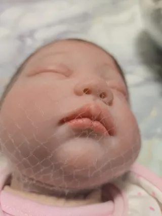 Bambola reborn con vestitino rosa