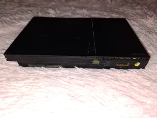 PlayStation 2 Slim Negra funcionando