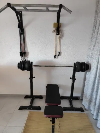 Banco de pesas y barra con discos