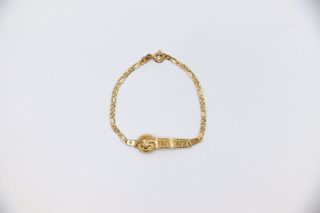 ESCLAVA DE NIÑO MEDUSA Y GRECA. Oro 18k.