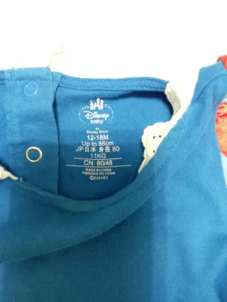 Disfraz de bebé azul con volantes amarillos