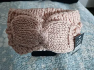 Diadema de punto rosa con lazo