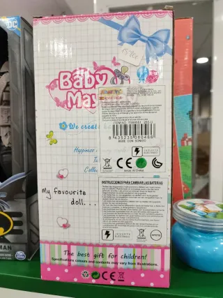 Muñeca bebé con sonido y lazo