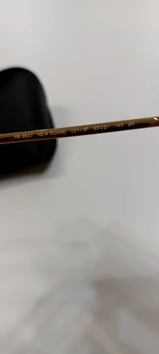 Gafas de sol Ray-Ban redondas doradas